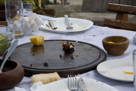 Messy table with empty dirty dishes after eating