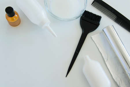 Hair dye tools on white background, space for textの写真素材