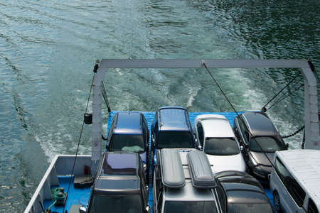 Vehicles parked on the ferry, space for text. Concepts - transportation and travel in security,...