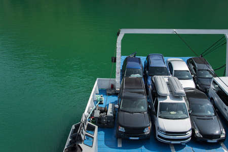 Vehicles parked on the ferry, space for text. Concepts - transportation and travel in security,...