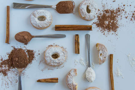 Pastry background  - delicious homemade bakery products on white background - cookies, cocoa spoon,...