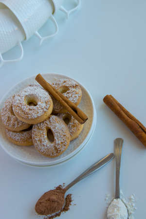 Pastry background  with space for text - delicious homemade cinnamon cookies  on white background