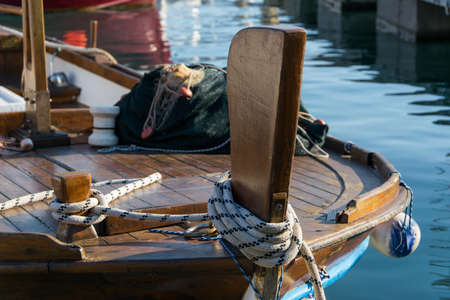 Traditional wooden fishing boat in  marina harbor of Mediterranean city Budva, Montenegro. Fishing industry/tourismの写真素材