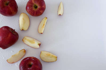 Top view of crispy red apples on white background, space for text.  Healthy eating, agricultural industry conceptの写真素材
