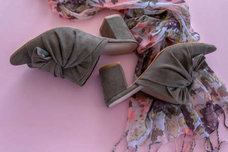 Pair of mules/clogs (military green color) and flower scarf on pink background