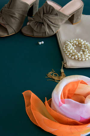 Top view of fashion female flat lay on deep green backgroundの写真素材