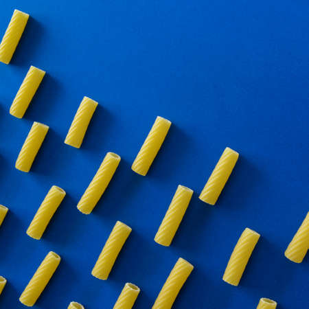 Abstract food background, Italian pasta products on blue backgroundの写真素材