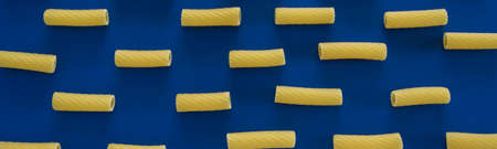 Abstract food background, Italian pasta products on blue background