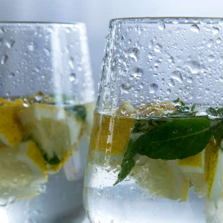 Refreshment ice drink/cocktail with raw lemons and mint