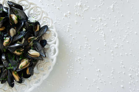 Cooked delicious black mussel, salty white background. Healthy eating concept, rich protein  foodの写真素材