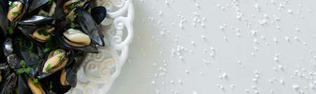 Cooked delicious black mussel, salty white background. Healthy eating concept, rich protein  foodの写真素材