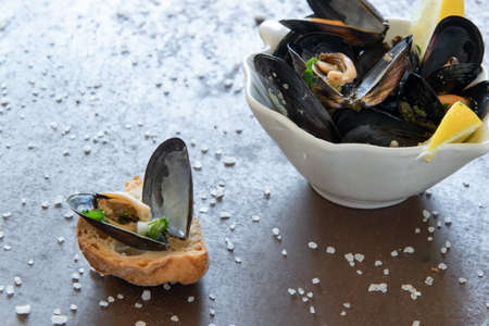 Cooked delicious black mussel with toasted bread. Healthy eating concept, rich protein  foodの写真素材