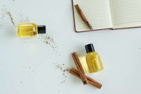 Top view of bottles with cinnamon essential oil. Healthy cosmetic productの写真素材