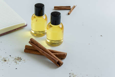 Top view of bottles with cinnamon essential oil. Healthy cosmetic productの写真素材