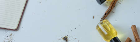 Top view of bottles with cinnamon essential oil. Healthy cosmetic productの写真素材