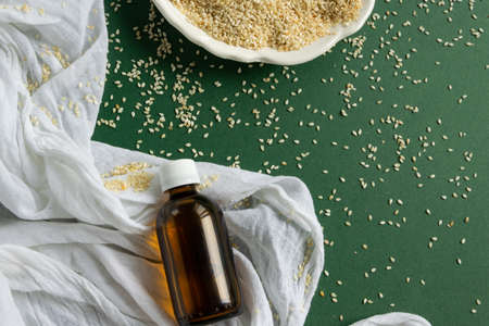 Top view of bottles with sesame seed essential oil. Massage cosmetic treatmentの写真素材