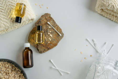 Top view of bottles with oats essential oil. Health care cosmetic productsの写真素材