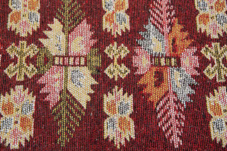 Crop view of traditional handmade carpet. Ethnic motives