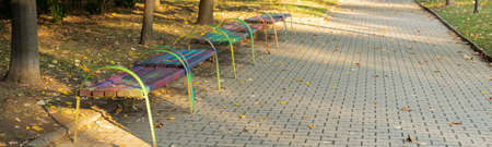 Peaceful autumn walkway in the city parkの写真素材