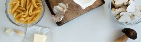 Top view of ingredients for cream pasta with porcini mushrooms (Boletus edible)の写真素材