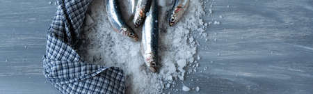 Preparing anchovies in salt. Healthy raw seafoodの写真素材