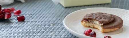 Tasty homemade biscuits with chocolate and pomegranateの写真素材