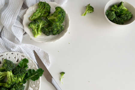Preparing raw broccoli florets for cooking, cooking fresh vegetables, healthy ingredient, still lifeの写真素材