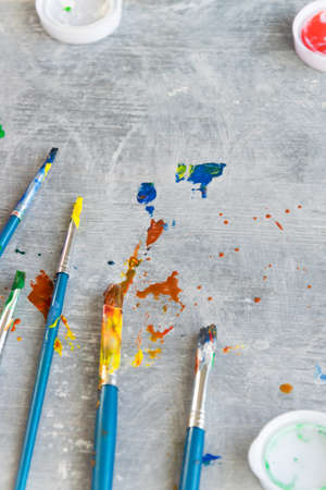 Paint brushes on grey background, artistic craft concept, space for textの写真素材