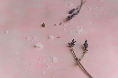 Natural wellness beauty ingredients on pink background. Health care spa therapy with sea salt and...