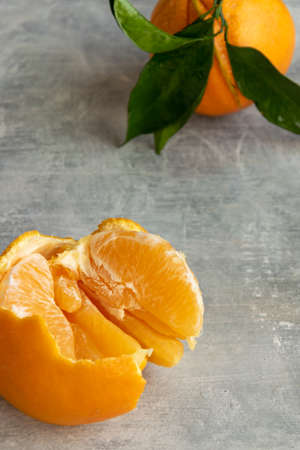 Ripe oranges on grey background. Vitaminic tropical food