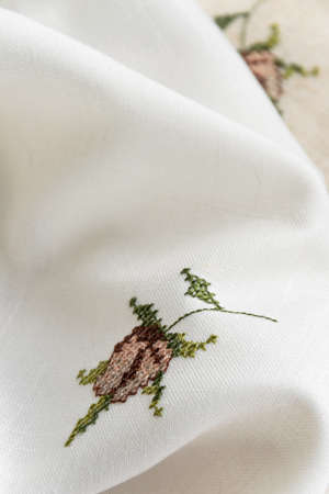 Close up view of the linen napkin with embroidery, piece of vintage calicoの写真素材