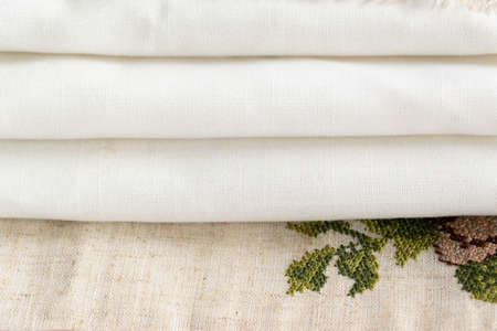 Close up view of the linen napkin with embroidery, piece of vintage calicoの写真素材