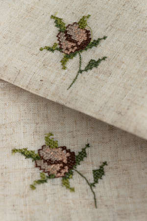 Close up view of the linen napkin with embroidery, piece of vintage calicoの写真素材