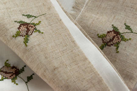 Close up view of the linen napkin with embroidery, piece of vintage calicoの写真素材