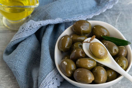 Green olives and olive oil, healthy eating, cooking ingredientsの写真素材