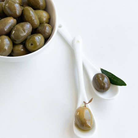Green olives and olive oil, healthy eating, cooking ingredientsの写真素材
