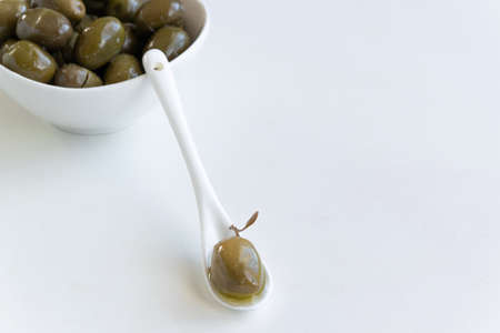 Green olives and olive oil, healthy eating, cooking ingredientsの写真素材