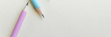 Pastel colored pencils on empty sheetの写真素材