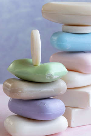 Different handmade  bar soaps on pink background. Hygiene, artisanal productsの写真素材