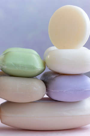 Different handmade  bar soaps on pink background. Hygiene, artisanal productsの写真素材