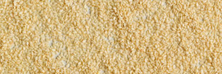 Close up view of dry sesame seeds on white background. Natural oil-rich foodの写真素材