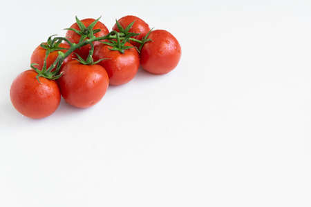 Healthy food ingredient - raw tomatoes on white background, vibrant colours, vitamin food, space for...