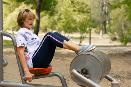 Senior woman in retirement age making sport outdoor
