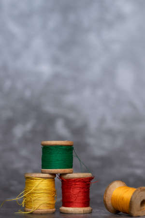 Different colorful cotton mill on gray backgroundの写真素材