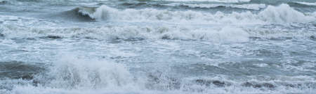 Winter seascape background, splashing water wavesの写真素材