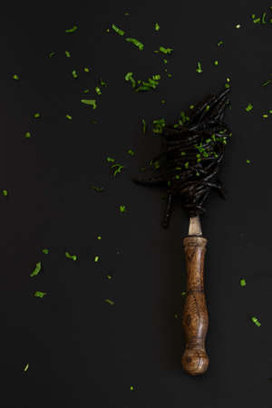Black spaghetti pasta with Cuttlefish ink. Black seafood pasta on a dark background. Mediterranean delicacy food.の写真素材