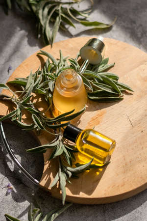 Essential oil with sage leaves extract. Hygiene bath product. Wellness therapy regenerationの写真素材