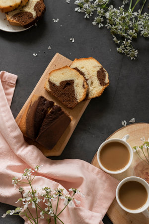 Delicious homemade marble pound cake and milk coffeeの写真素材