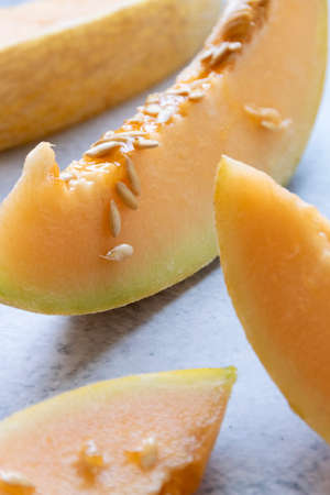 Fresh melon sliced on table, raw ripe biological fruit, food background