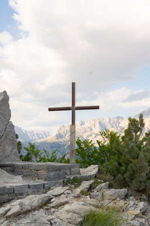 Tomb with religious cross in the mountainsの写真素材
